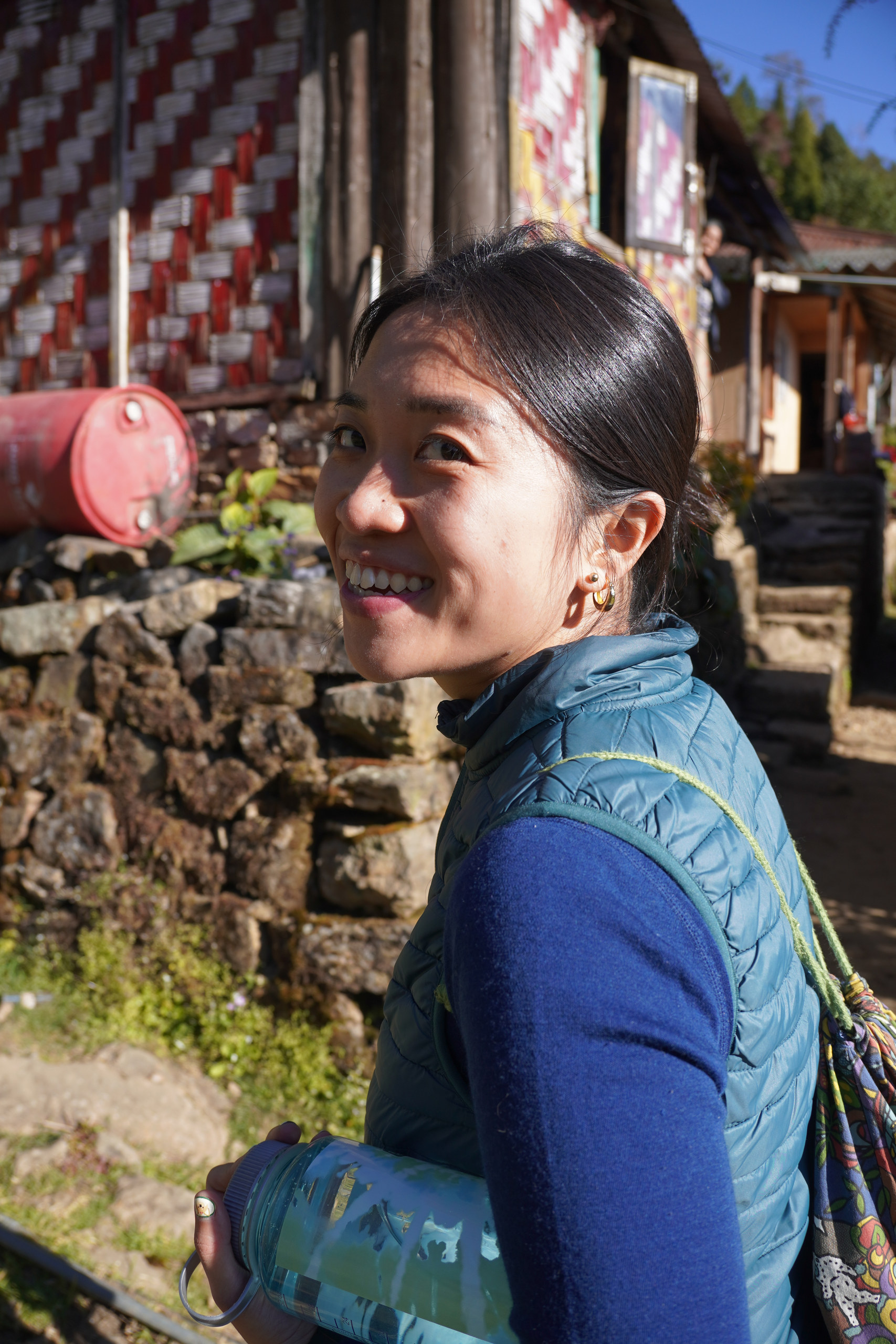Zi Hui walking through a village in Sikkim